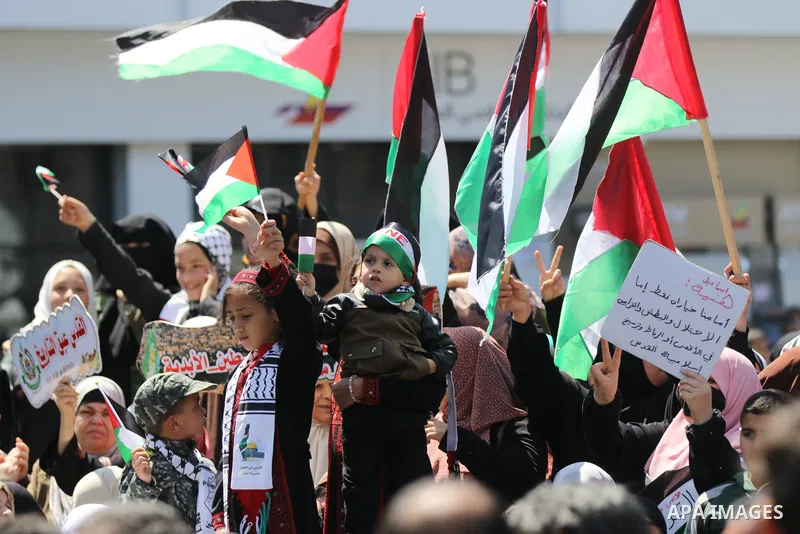 Supporters of the Palestinian Hamas and Islamic Jihad movements rally after Friday prayers in Gaza City on April 15, 2022, following clashes at Jerusalem's Aqsa mosque compound. - More than 150 people were wounded in fre...