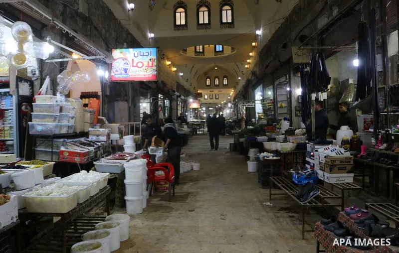 Syrians shop at a market ahead of Muslims holy fasting month Ramadan, in the city of Azaz, Syria on March 31, 2022. Photo by Samir Abed