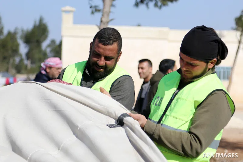 Displaced Syrian refugees work in cultivating the land in the camps as part of a project cash for work, near the city of al-Bab, in the eastern countryside of Aleppo province, Syria on March 2, 2022. Photo by Samir Abed