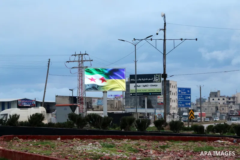 Signs are seen on roads against the Russian invasion of Ukraine in Azaz city, Syria on March 9, 2022. Photo by Samir Abed
