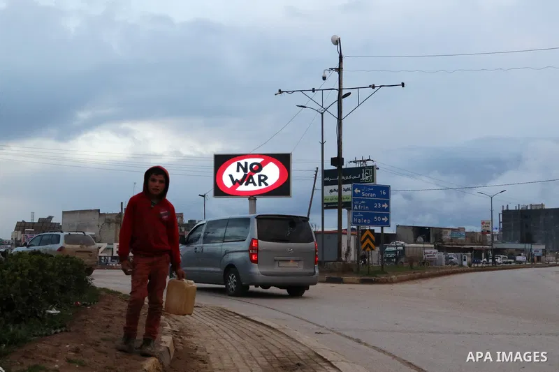 Signs are seen on roads against the Russian invasion of Ukraine in Azaz city, Syria on March 9, 2022. Photo by Samir Abed