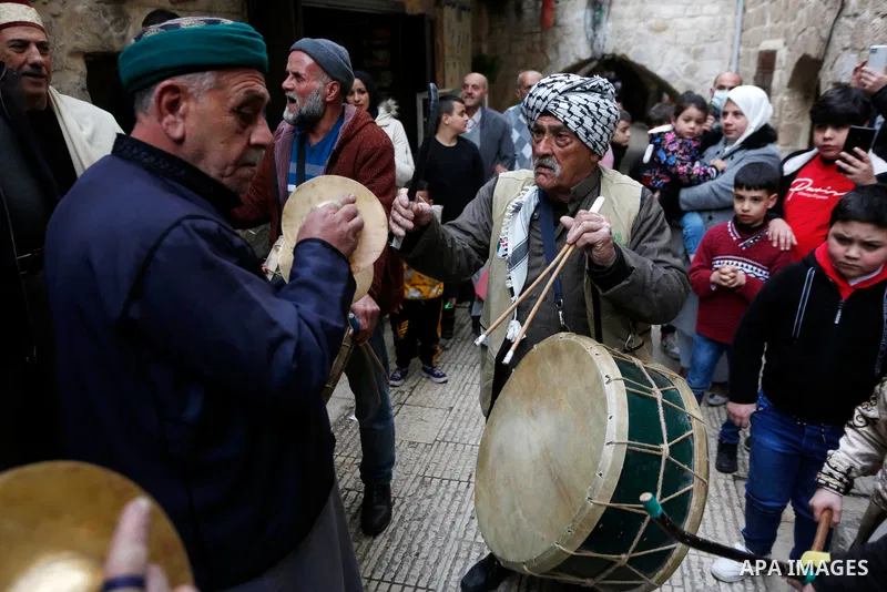 Palestinian sufis perform during a celebration of the Islamic holiday of Isra Mi'raj, in the old city of the West Bank city of Nablus, Feb. 28, 2022. The holiday marks what Muslims believe is the Prophet Mohammad's journ...