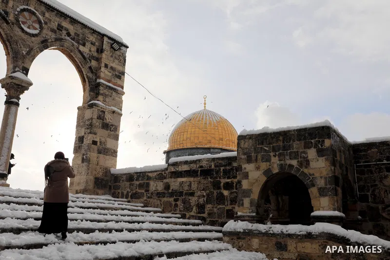 A view shows snow-covered the Dome of the Rock, in Al-Aqsa mousque compound in Jerusalem's Old City following overnight snowfall, on January 27, 2022. Winter storm 'Elpis' hit the region bringing cold temperatures and sn...