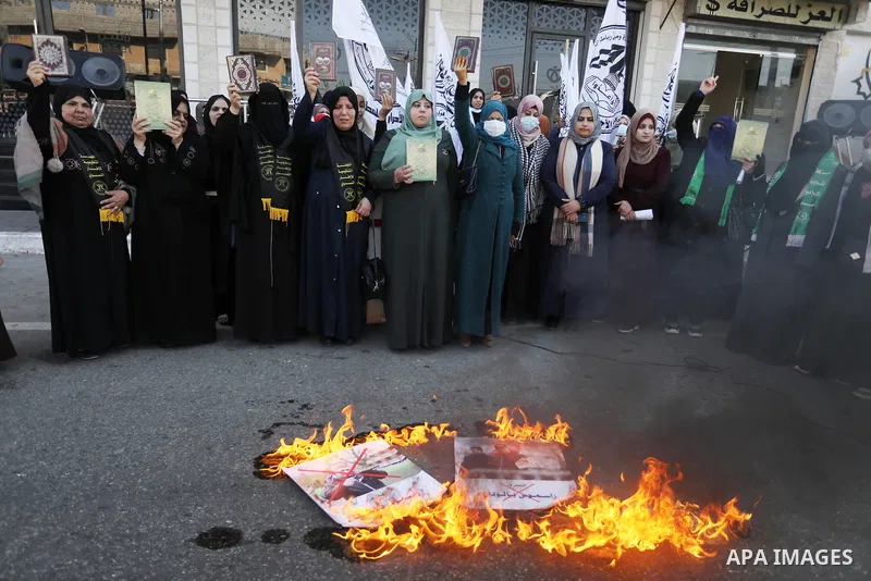 Palestinians hold Koran during a protest the burning of a copy of the Muslim holy book of Koran by a far-right politician Outside the Turkish Embassy in Stockholm in the Nuseirat refugee camp in the central Gaza Strip on...