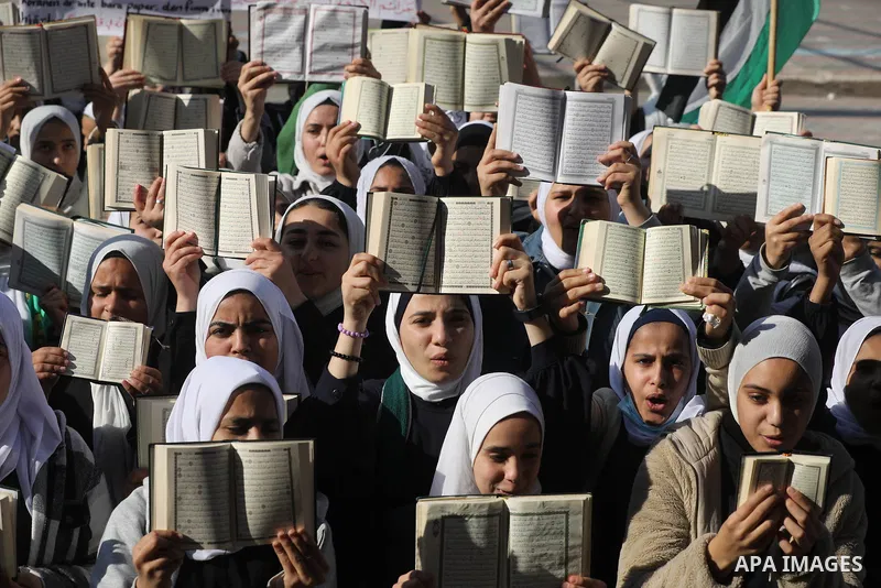 Palestinian students take part in a protest the burning of a copy of the Muslim holy book of Koran by a far-right politician Outside the Turkish Embassy in Stockholm at their school in Khan Yunis, in the southern Gaza St...