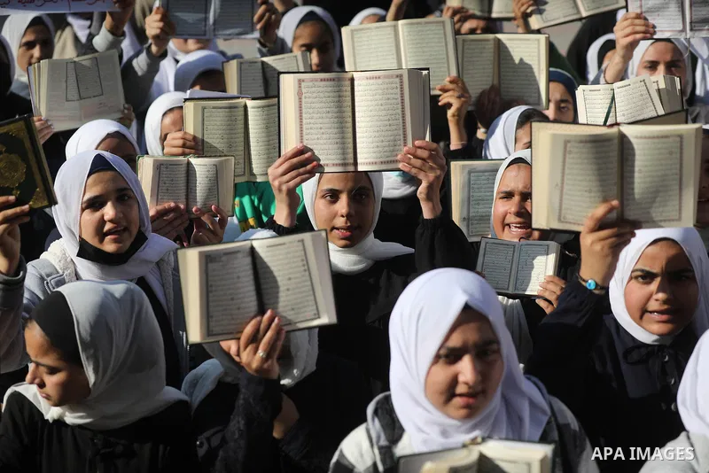 Palestinian students take part in a protest the burning of a copy of the Muslim holy book of Koran by a far-right politician Outside the Turkish Embassy in Stockholm at their school in Khan Yunis, in the southern Gaza St...