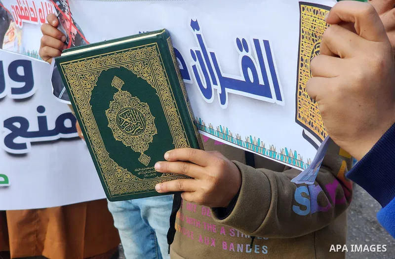 Palestinian take part in a protest the burning of a copy of the Muslim holy book of Koran by a far-right politician Outside the Turkish Embassy in Stockholm and the decision of the Israeli Minister of National Security,...