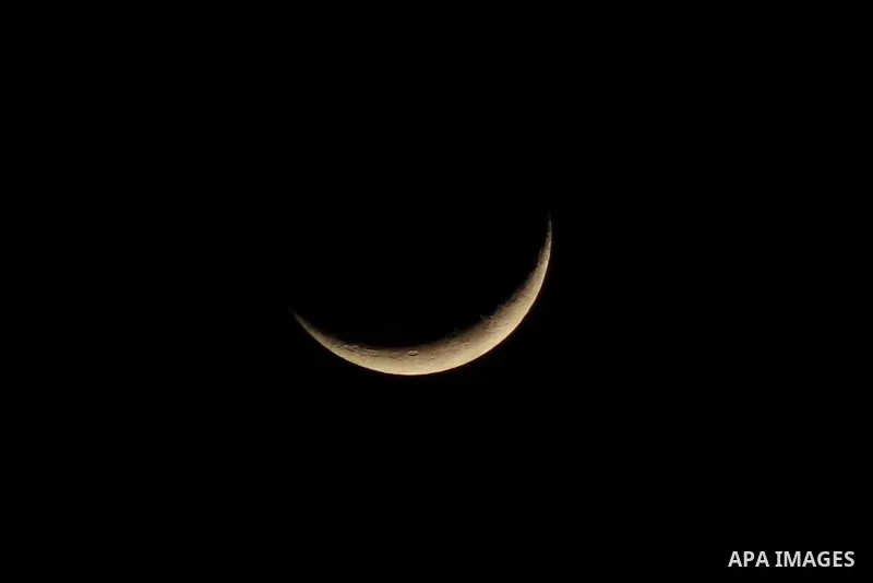 Crescent moon appears over Gaza city on January 23, 2023. Photo by Ali Hamad\ apaimages