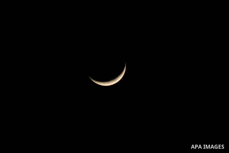 Crescent moon appears over Gaza city on January 23, 2023. Photo by Ali Hamad\ apaimages