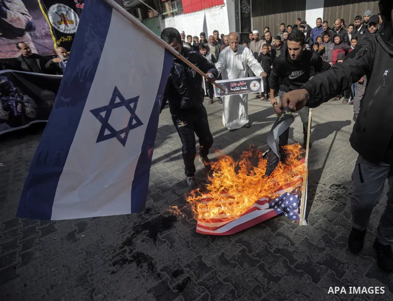January 27, 2023, Gaza City, The Gaza Strip, Palestine: Palestinian supporters of the Islamic Jihad movement burn the flags of Israel and America during a demonstration in the Jabalia camp in the northern Gaza Strip, in...
