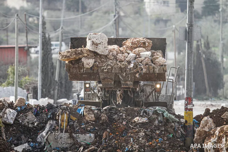 Palestinians clash with Israeli security forces during a protest against block the entrance of the Beita town by the Israeli army in the village of Beita, near the West Bank city of Nablus, on January 28, 2023. Eye witne...
