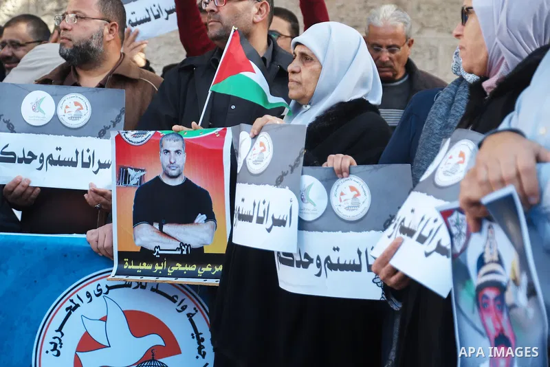 Palestinians take part in a protest in support prisoners in Israeli jails, in front of Red Cross office in Gaza city on January 30, 2023. Nearly 7,000 Palestinians were arrested by the Israeli forces in the Palestinian T...