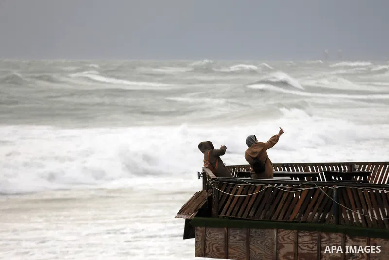 Palestinians enjoy during stormy weather along a beach by the Mediterranean Sea in Gaza City on Feb. 01, 2023. Photo by Islam Yasser\ apaimages