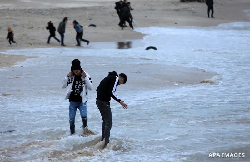Palestinians enjoy during stormy weather along a beach by the Mediterranean Sea in Gaza City on Feb. 01, 2023. Photo by Islam Yasser\ apaimages
