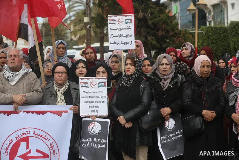 Palestinians take part in a rally in solidarity with Turkey and Syria following a deadly earthquake, in Gaza city on February 09, 2023. Turkey's death toll has risen to 12,873 overnight, from 12,391 late on Wednesday, th...