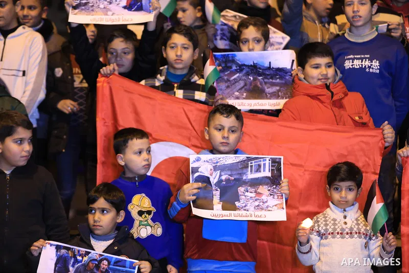 Palestinian children attend a gathering in solidarity with the people of Turkey and Syria following a devastating earthquake, in Gaza city on Feb. 09, 2023. A 7.8-magnitude earthquake hit Turkey and Syria on February 6,...