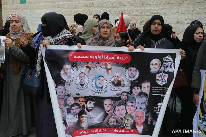 Palestinians take part in a protest in solidarity with prisoners in Israeli jails, in front of Red cross office, in Gaza city on Feb. 13, 2023. Nearly 7,000 Palestinians were arrested by the Israeli forces in the Palesti...