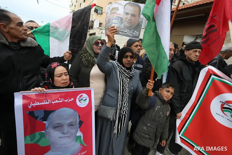 Palestinians take part in a protest in solidarity with prisoners in Israeli jails, in front of Red cross office, in Gaza city on Feb. 13, 2023. Nearly 7,000 Palestinians were arrested by the Israeli forces in the Palesti...