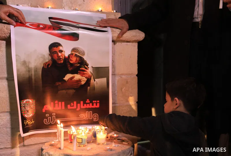 Palestinians light candles during a gathering in solidarity with the people of Turkey and Syria following a devastating earthquake, in Gaza city on Feb. 13, 2023. A 7.8-magnitude earthquake hit Turkey and Syria on Februa...