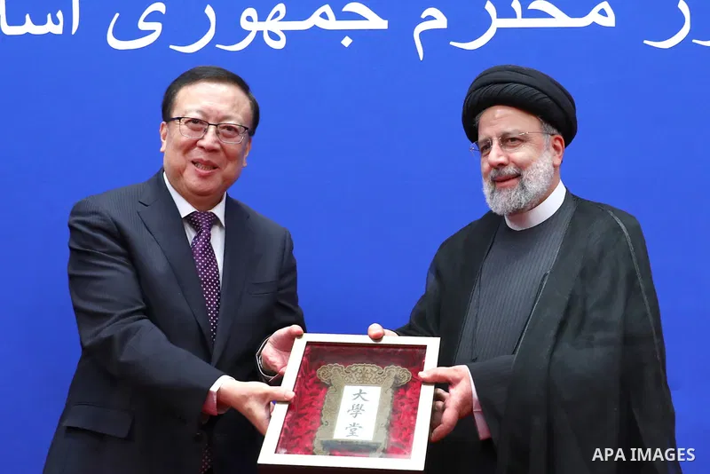 Iranian President Ebrahim Raisi awarding the title of honorary professor of Peking University in Beijing on Feb. 15, 2023. Photo by Iranian Presidency Office/APAimages