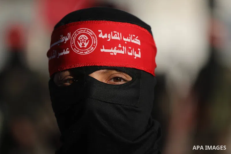 Palestinian supporters of Democratic Front for the Liberation of Palestine take part in a rally marking the 54th anniversary of the movement's foundation, in Nuseirat in the center of Gaza Strip on Feb. 19, 2023. Photo b...