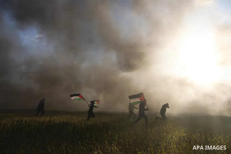 Palestinians burn tires during a protest against the killing of 10 Palestinians during an Israeli raid in Nablus near the fence with Israel east of Gaza city on Feb. 22, 2023. 10 Palestinians were killed and dozens shot...
