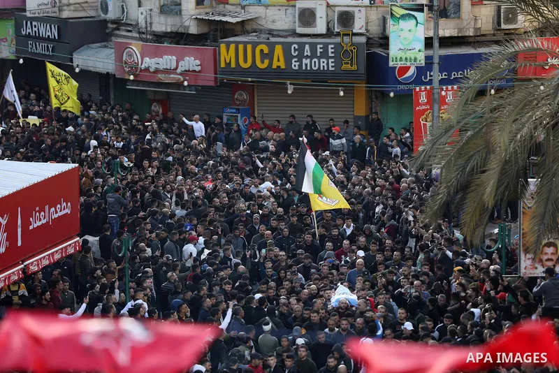Mourners carry the bodies of 10 Palestinians who was killed by Israeli forces during a raid, in the West Bank city of Nablus on Feb. 22, 2023. 10 Palestinians were killed and dozens shot in an raid by the Israeli militar...