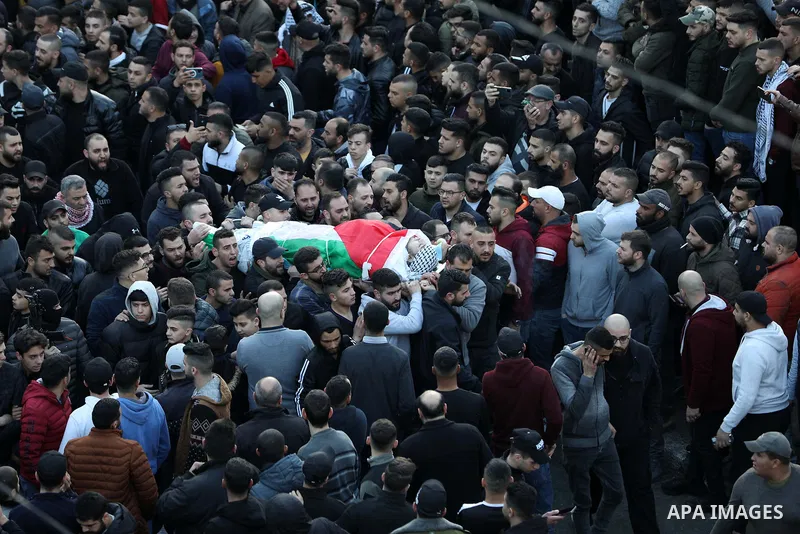 Mourners carry the bodies of 10 Palestinians who was killed by Israeli forces during a raid, in the West Bank city of Nablus on Feb. 22, 2023. 10 Palestinians were killed and dozens shot in an raid by the Israeli militar...