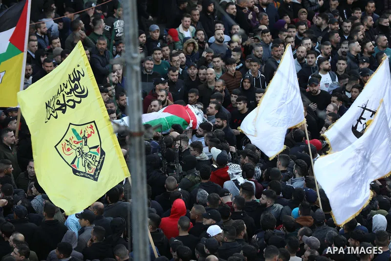 Mourners carry the bodies of 10 Palestinians who was killed by Israeli forces during a raid, in the West Bank city of Nablus on Feb. 22, 2023. 10 Palestinians were killed and dozens shot in an raid by the Israeli militar...