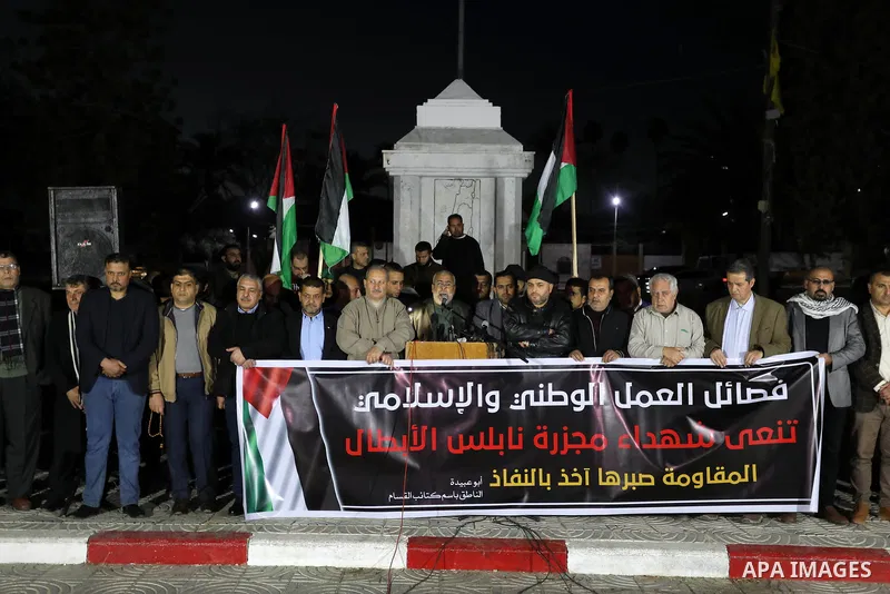 Palestinians take part in a protest following the killing of 10 Palestinians during an Israeli raid in Nablus, on Feb. 22, 2023 in Gaza City. Israeli troops killed 10 Palestinians in a raid on Nablus, while some 80 more...