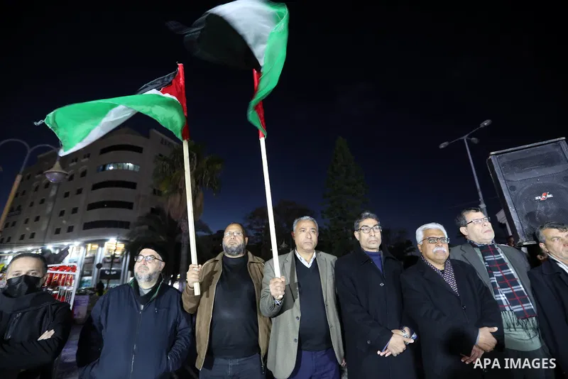 Palestinians take part in a protest following the killing of 10 Palestinians during an Israeli raid in Nablus, on Feb. 22, 2023 in Gaza City. Israeli troops killed 10 Palestinians in a raid on Nablus, while some 80 more...