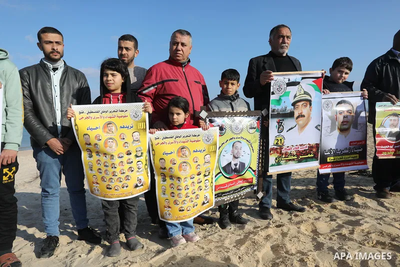 Palestinians take part in racing Pigeon sport as supporting of prisoner in Israeli jails on a beach along the Gaza sea barrier on the border with Israel near Kibbutz Zikim, north of Beit Lahia in the northern Gaza Strip...
