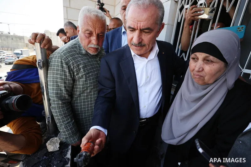Palestinian Prime Minister Mohammad Shtayyeh checks damaged Palestinian property as he visits Huwara town in the West Bank, on March 1, 2023, following deadly violence by Israeli settlers. Photo by Shadi Hatem\ apaimages