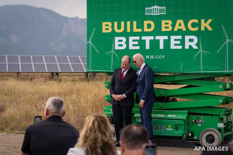 US President Joe Biden confers with Gov. Jared Polis before delivering remarks on Build Back Better, Tuesday, September 14, 2021, at the National Renewable Energy Laboratory Flatirons Campus in Arvada, Colorado. Photo by...