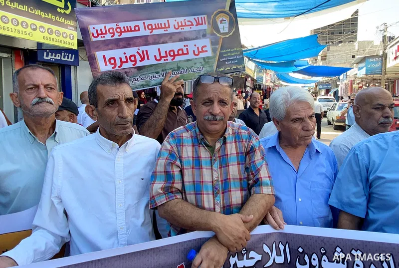 Palestinians take part in a protest against the UNRWA aid cuts, in front of the UNRWA aid distribution center, at the Nuseirat refugee camp in the central Gaza Strip, on September 21, 2023.The United Nations is warning o...