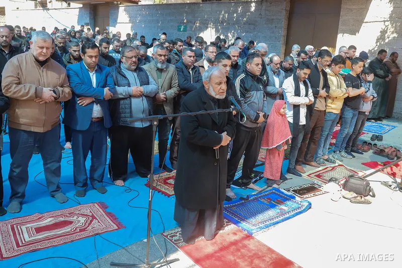 Palestinians attend Friday prayer in support of the prisoners in Israeli jails, in front of Red Cross office, in Gaza city on March 10, 2023. As many as 4,780 Palestinians are imprisoned in Israeli jails, including 160 c...