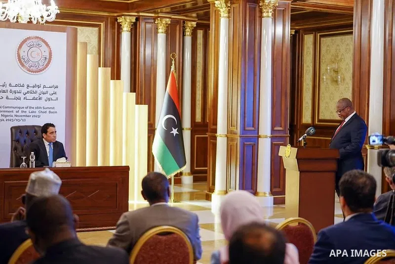 Iraqi President Muhammad al-Munfi signs the closing statement of the sixteenth regular session of the Heads of State of the Member States of the Lake Chad Basin Commission, Tripoli on March 13, 2023. Photo by Iraqi Presi...