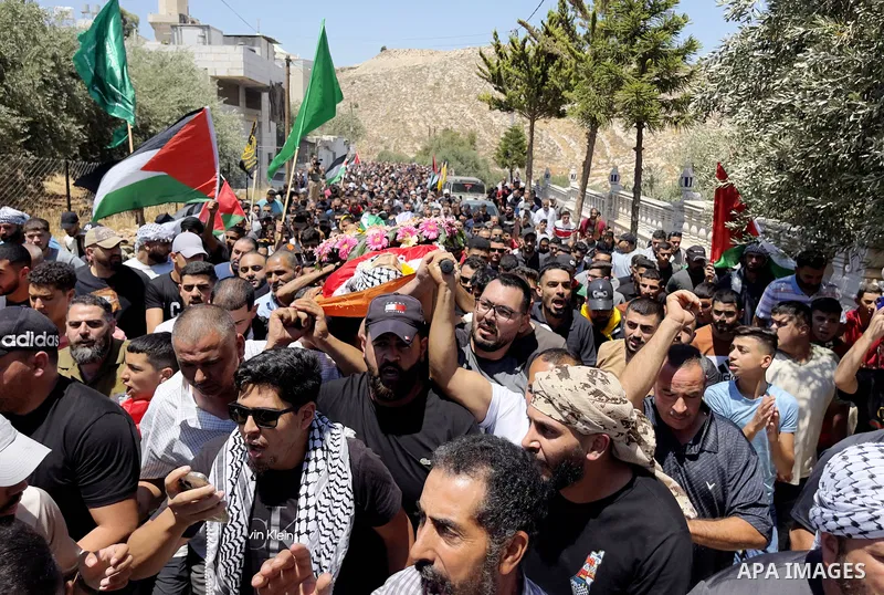 Palestinians carry the body of Qusai Maatan, 19, during his funeral in the village of Burqa in the north of the West Bank on August 5, 2023. Two Palestinians in the West Bank were shot by Israelis on August 4, one by sol...
