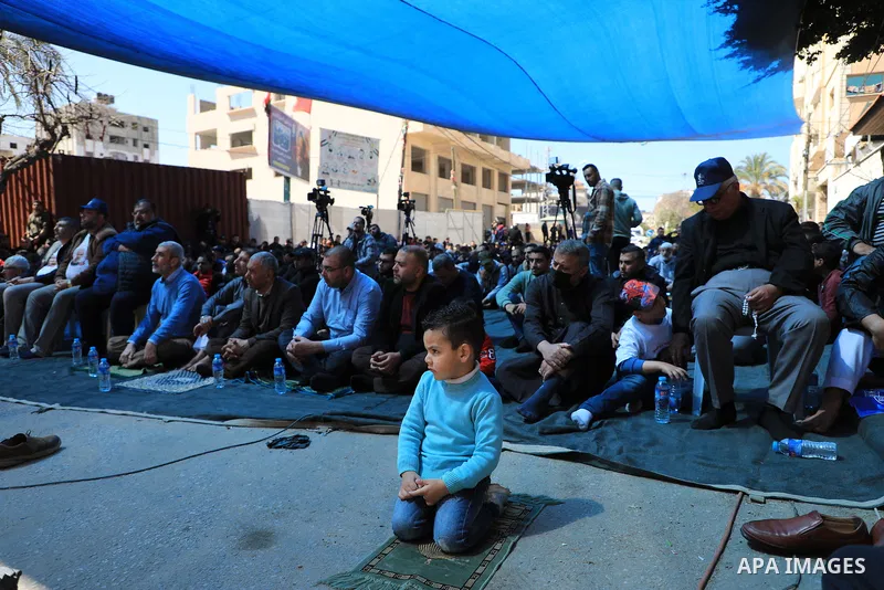 Palestinians attend Friday prayer in front of Red Cross office to support prisoners in Israeli jails, in Gaza city on March 17, 2023. Thousands of Palestinian political prisoners in Israeli prisons continue their civil d...