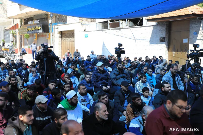 Palestinians attend Friday prayer in front of Red Cross office to support prisoners in Israeli jails, in Gaza city on March 17, 2023. Thousands of Palestinian political prisoners in Israeli prisons continue their civil d...