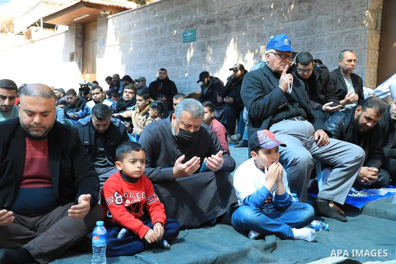 Palestinians attend Friday prayer in front of Red Cross office to support prisoners in Israeli jails, in Gaza city on March 17, 2023. Thousands of Palestinian political prisoners in Israeli prisons continue their civil d...