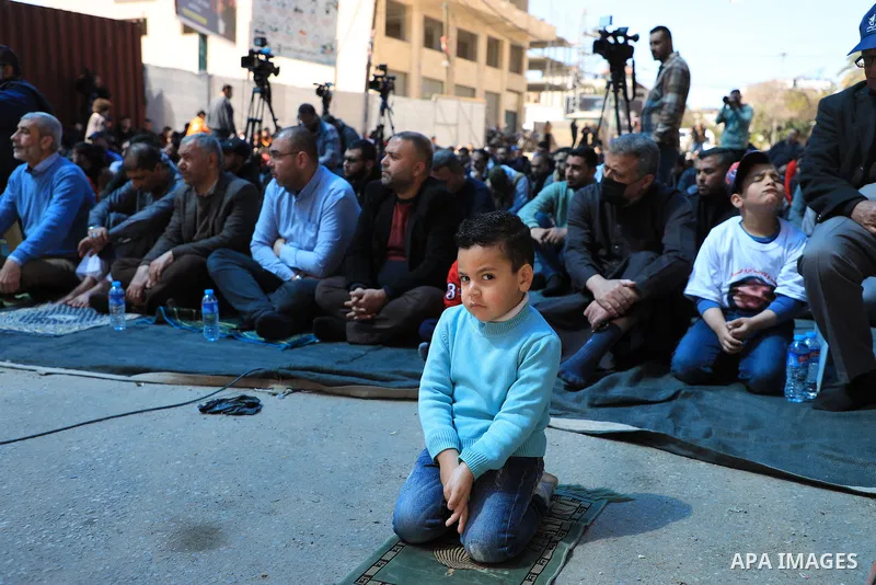Palestinians attend Friday prayer in front of Red Cross office to support prisoners in Israeli jails, in Gaza city on March 17, 2023. Thousands of Palestinian political prisoners in Israeli prisons continue their civil d...