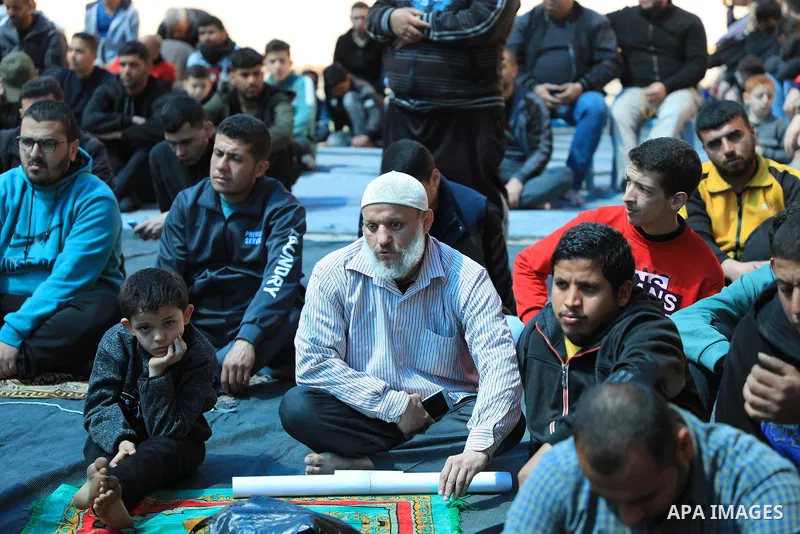 Palestinians attend Friday prayer in front of Red Cross office to support prisoners in Israeli jails, in Gaza city on March 17, 2023. Thousands of Palestinian political prisoners in Israeli prisons continue their civil d...