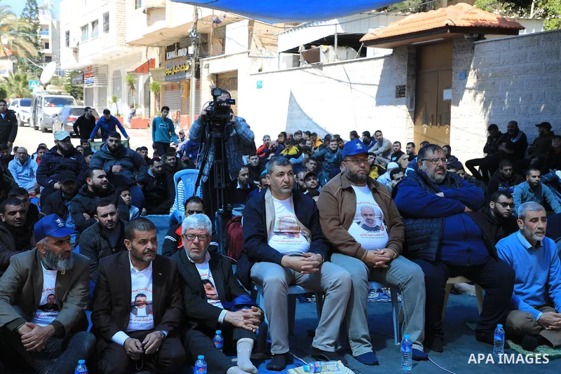 Palestinians attend Friday prayer in front of Red Cross office to support prisoners in Israeli jails, in Gaza city on March 17, 2023. Thousands of Palestinian political prisoners in Israeli prisons continue their civil d...