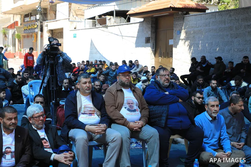 Palestinians attend Friday prayer in front of Red Cross office to support prisoners in Israeli jails, in Gaza city on March 17, 2023. Thousands of Palestinian political prisoners in Israeli prisons continue their civil d...