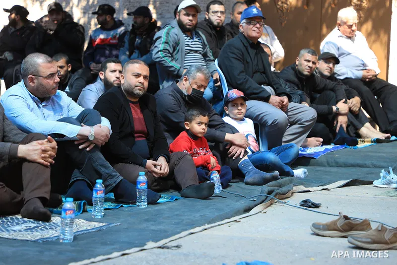 Palestinians attend Friday prayer in front of Red Cross office to support prisoners in Israeli jails, in Gaza city on March 17, 2023. Thousands of Palestinian political prisoners in Israeli prisons continue their civil d...