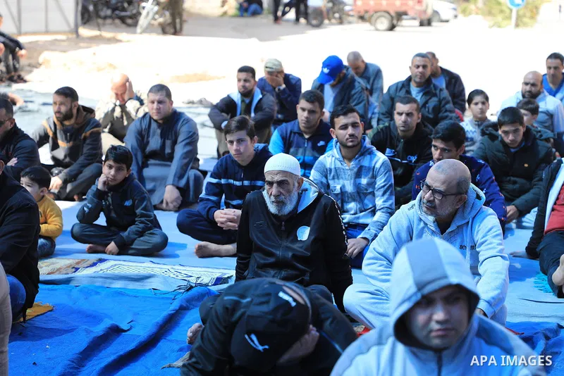 Palestinians attend Friday prayer in front of Red Cross office to support prisoners in Israeli jails, in Gaza city on March 17, 2023. Thousands of Palestinian political prisoners in Israeli prisons continue their civil d...