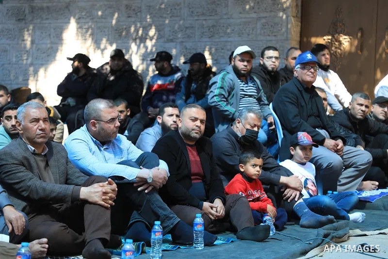 Palestinians attend Friday prayer in front of Red Cross office to support prisoners in Israeli jails, in Gaza city on March 17, 2023. Thousands of Palestinian political prisoners in Israeli prisons continue their civil d...