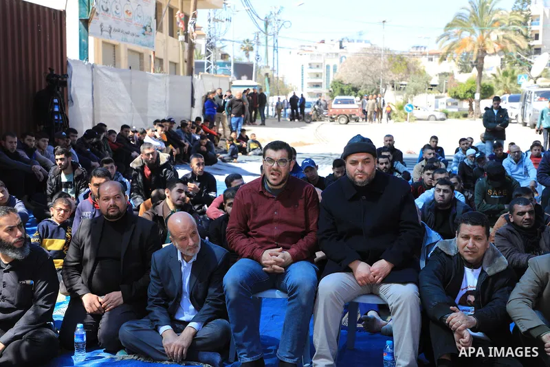 Palestinians attend Friday prayer in front of Red Cross office to support prisoners in Israeli jails, in Gaza city on March 17, 2023. Thousands of Palestinian political prisoners in Israeli prisons continue their civil d...