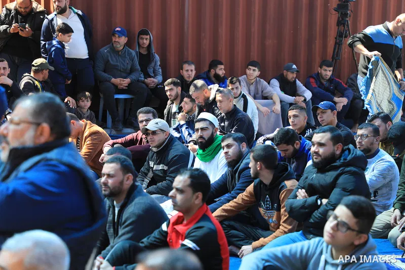 Palestinians attend Friday prayer in front of Red Cross office to support prisoners in Israeli jails, in Gaza city on March 17, 2023. Thousands of Palestinian political prisoners in Israeli prisons continue their civil d...